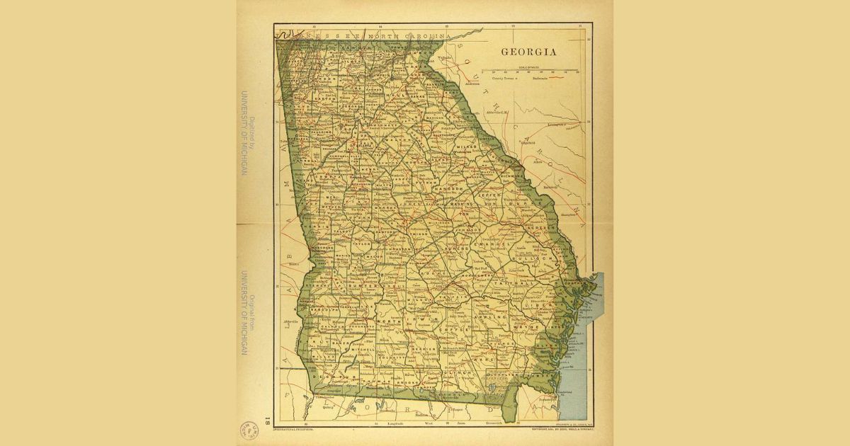 A vintage map of the state of Georgia, showing detailed county boundaries, major cities, and transportation routes. The map includes neighboring states Tennessee, North Carolina, South Carolina, Florida, and Alabama. At the top right corner, the map is labeled Georgia. A scale is displayed at the bottom of the map. The map is credited to the University of Michigan.